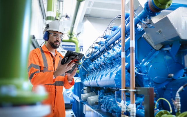 Engineer Working at Power Plant Station
